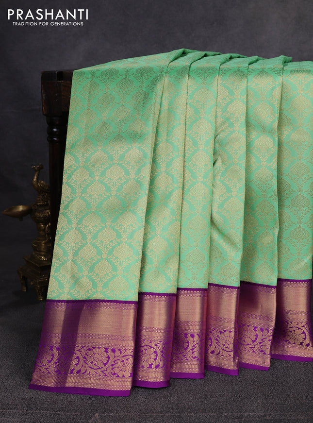 Pure kanchipuram silk saree light green and purple with allover zari woven brocade weaves and rich zari woven border