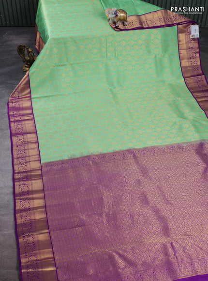 Pure kanchipuram silk saree light green and purple with allover zari woven brocade weaves and rich zari woven border