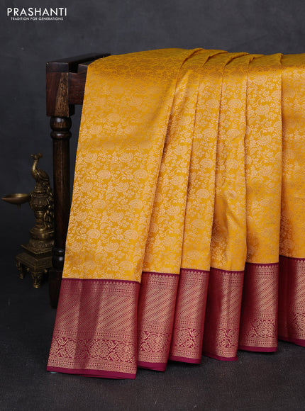 Pure kanchipuram silk saree yellow and dark magenta pink with allover zari woven brocade weaves and zari woven korvai border