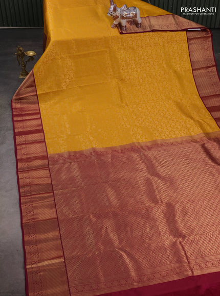 Pure kanchipuram silk saree yellow and dark magenta pink with allover zari woven brocade weaves and zari woven korvai border