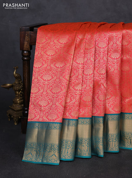 Pure kanchipuram silk saree orange and teal green with allover zari woven brocade weaves and rich zari woven korvai border