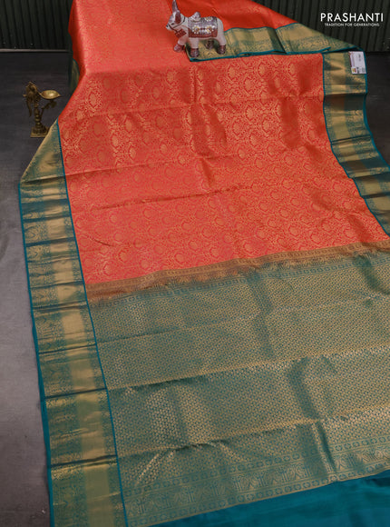 Pure kanchipuram silk saree orange and teal green with allover zari woven brocade weaves and rich zari woven korvai border
