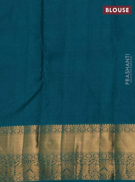 Pure kanchipuram silk saree orange and teal green with allover zari woven brocade weaves and rich zari woven korvai border