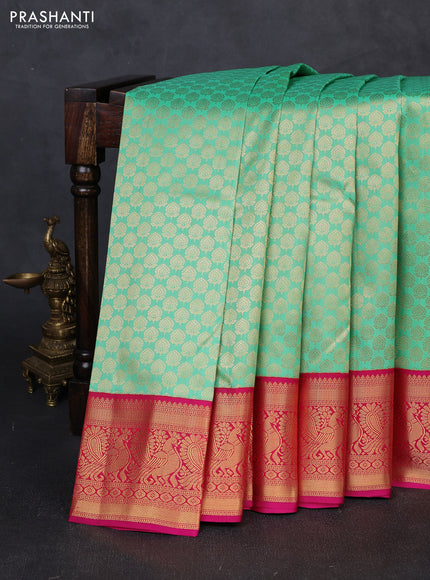 Pure kanchipuram silk saree teal green and pink with allover zari woven brocade pattern and zari woven korvai border