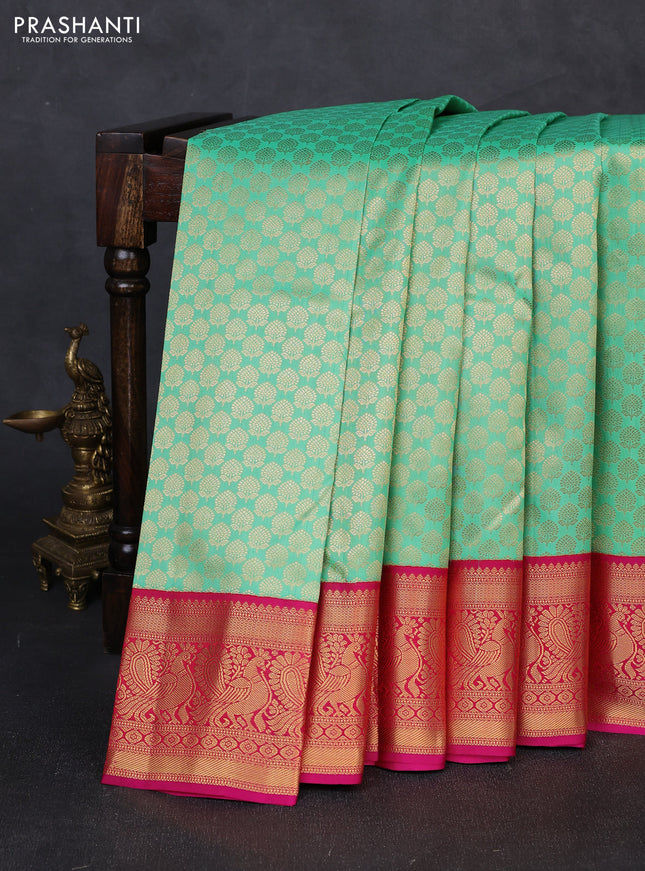 Pure kanchipuram silk saree teal green and pink with allover zari woven brocade pattern and zari woven korvai border
