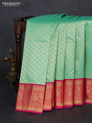 Pure kanchipuram silk saree teal green and pink with allover zari woven brocade pattern and zari woven korvai border