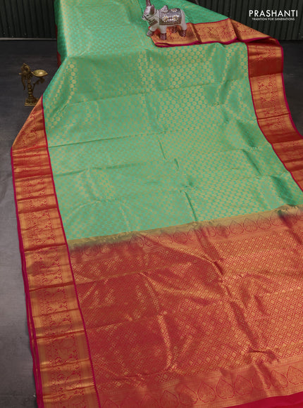 Pure kanchipuram silk saree teal green and pink with allover zari woven brocade pattern and zari woven korvai border