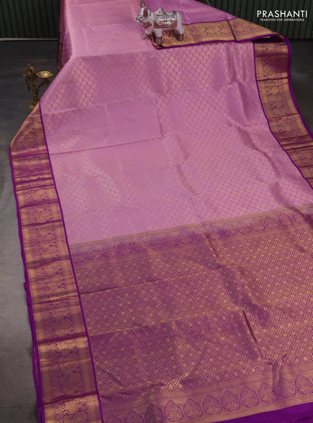 Pure kanchipuram silk saree lavender and purple with allover zari woven brocade pattern and zari woven korvai border