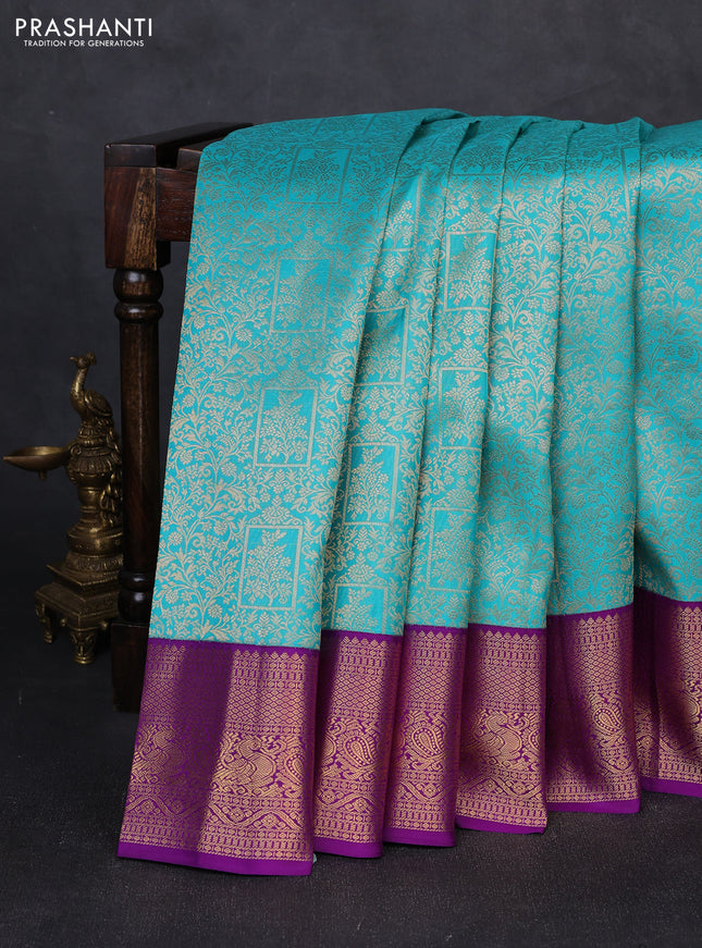 Pure kanchipuram silk saree teal blue and purple with allover zari woven brocade weaves and zari woven korvai border