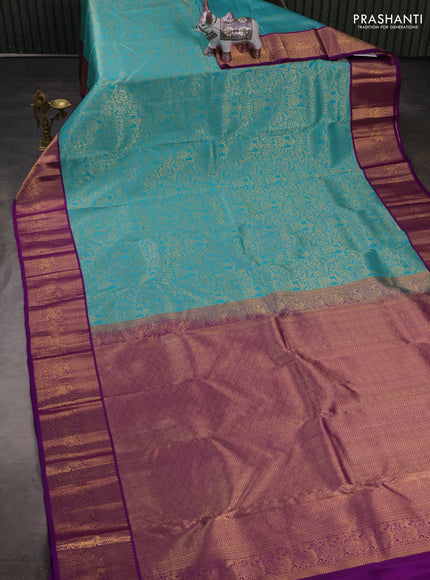 Pure kanchipuram silk saree teal blue and purple with allover zari woven brocade weaves and zari woven korvai border