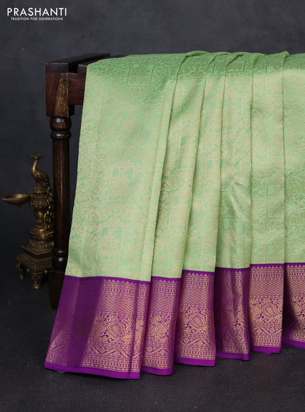 Pure kanchipuram silk saree teal green and purple with allover zari woven brocade weaves and zari woven korvai border