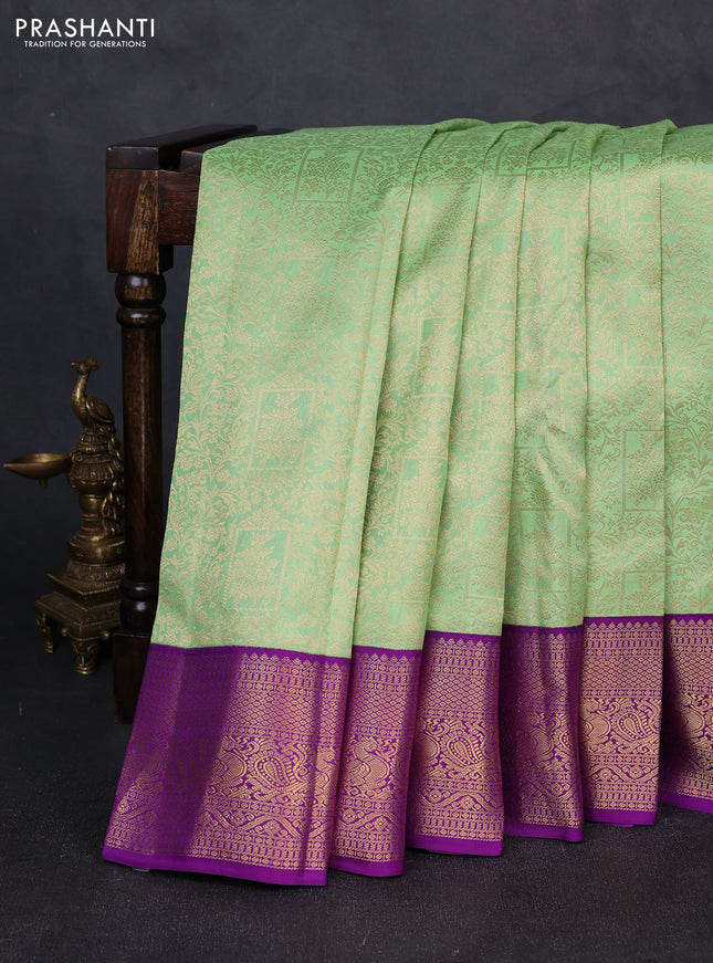 Pure kanchipuram silk saree teal green and purple with allover zari woven brocade weaves and zari woven korvai border