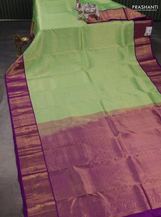 Pure kanchipuram silk saree teal green and purple with allover zari woven brocade weaves and zari woven korvai border