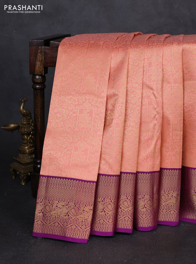 Pure kanchipuram silk saree peach shade and purple with allover zari woven brocade weaves and zari woven korvai border