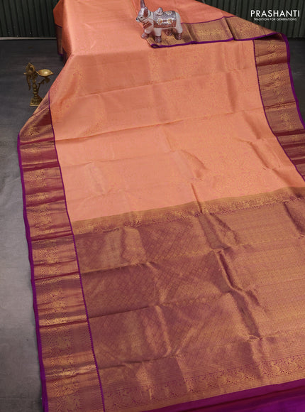 Pure kanchipuram silk saree peach shade and purple with allover zari woven brocade weaves and zari woven korvai border