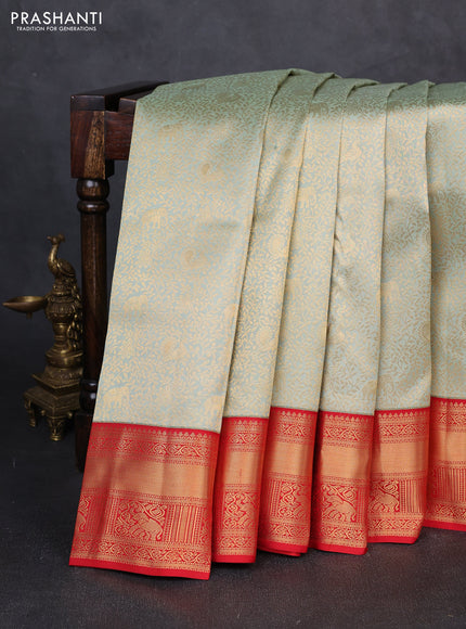 Pure kanchipuram silk saree mild pista green and red with allover zari woven brocade weaves and rich zari woven border