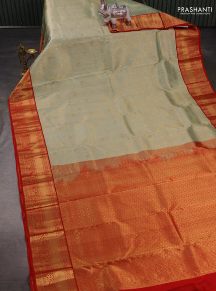Pure kanchipuram silk saree mild pista green and red with allover zari woven brocade weaves and rich zari woven border