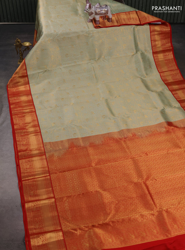 Pure kanchipuram silk saree mild pista green and red with allover zari woven brocade weaves and rich zari woven border