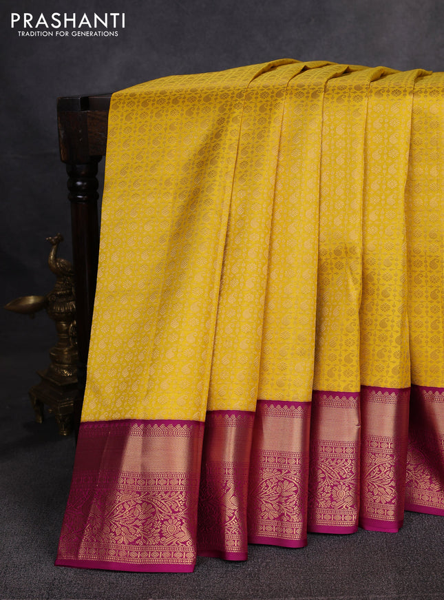 Pure kanchipuram silk saree yellow and magenta pink with allover zari woven brocade weaves and rich zari woven border
