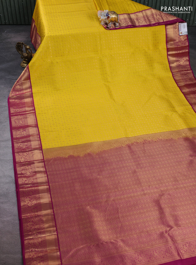 Pure kanchipuram silk saree yellow and magenta pink with allover zari woven brocade weaves and rich zari woven border