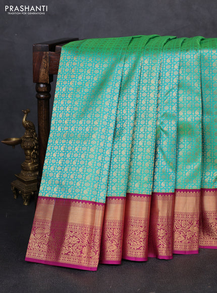 Pure kanchipuram silk saree teal green and magenta pink with allover zari woven brocade weaves and rich zari woven korvai border