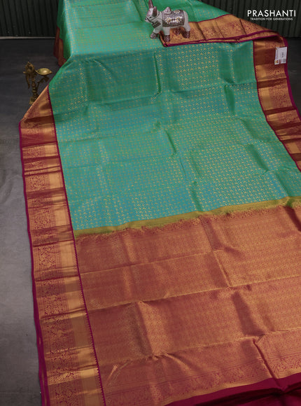 Pure kanchipuram silk saree teal green and magenta pink with allover zari woven brocade weaves and rich zari woven korvai border