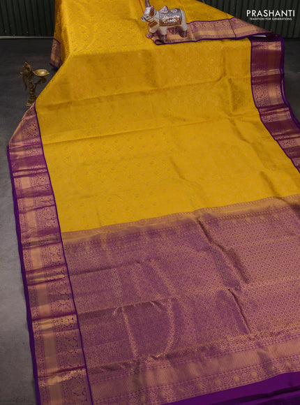 Pure kanchipuram silk saree yellow and purple with allover zari woven brocade weaves and rich zari woven border