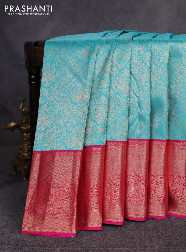 Pure kanchipuram silk saree teal blue and pink with allover zari woven brocade weaves and long zari woven border