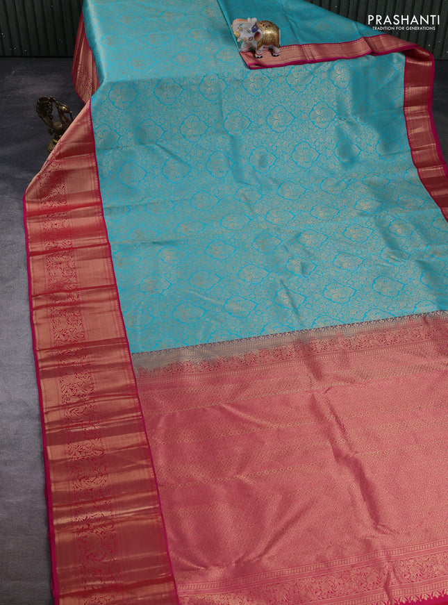 Pure kanchipuram silk saree teal blue and pink with allover zari woven brocade weaves and long zari woven border