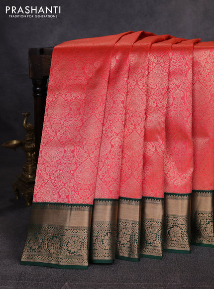 Pure kanchipuram silk saree orange and bottle green with allover zari woven brocade weaves and rich zari woven boder