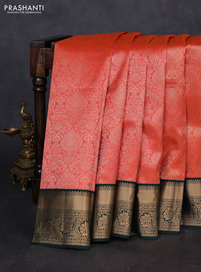 Pure kanchipuram silk saree orange and bottle green with allover zari woven brocade weaves and rich zari woven korvai border