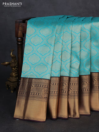 Pure kanchipuram silk saree deep wine and teal blue with allover zari woven brocade weaves and long rich zari woven korvai border