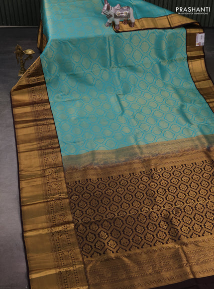 Pure kanchipuram silk saree deep wine and teal blue with allover zari woven brocade weaves and long rich zari woven korvai border