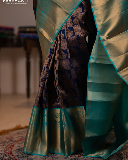 Pure kanchipuram silk saree navy blue and teal green with allover zari woven brocade weaves and long rich zari woven korvai border