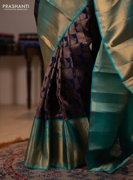 Pure kanchipuram silk saree navy blue and teal green with allover zari woven brocade weaves and long rich zari woven korvai border