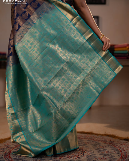 Pure kanchipuram silk saree navy blue and teal green with allover zari woven brocade weaves and long rich zari woven korvai border
