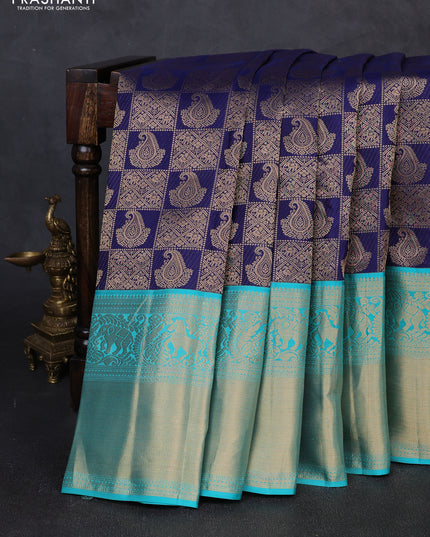 Pure kanchipuram silk saree navy blue and teal green with allover zari woven brocade weaves and long rich zari woven korvai border