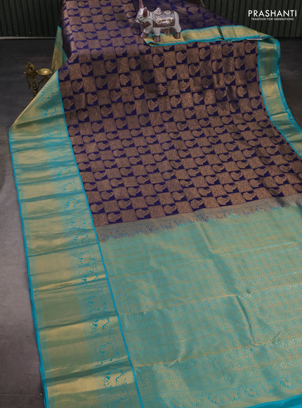 Pure kanchipuram silk saree navy blue and teal green with allover zari woven brocade weaves and long rich zari woven korvai border