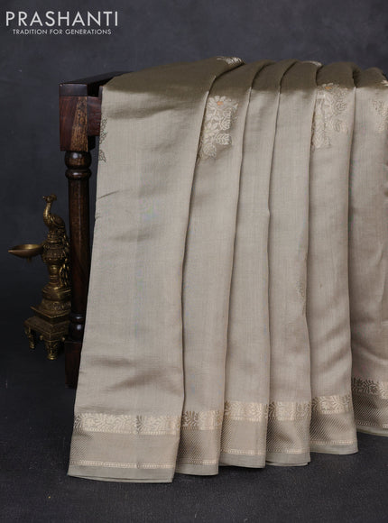 Chiniya silk saree pastel grey with zari woven buttas and rettapet zari woven border