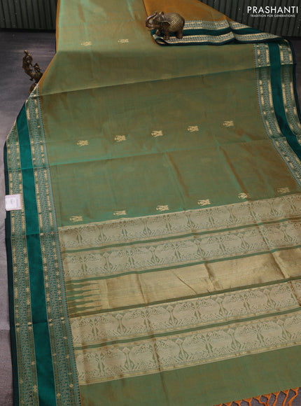 Kanchipuram silk cotton saree dual shade of greenish orange and green with zari woven buttas and rettapet zari woven border