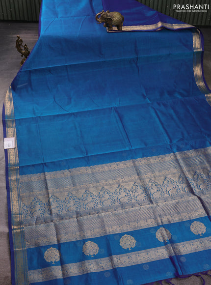 Kanchipuram silk cotton saree peacock blue with plain body and temple design zari woven border