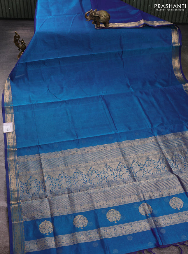 Kanchipuram silk cotton saree peacock blue with plain body and temple design zari woven border