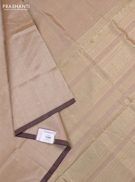 Kanchipuram silk cotton saree beige and brown shade with zari woven buttas and piping border
