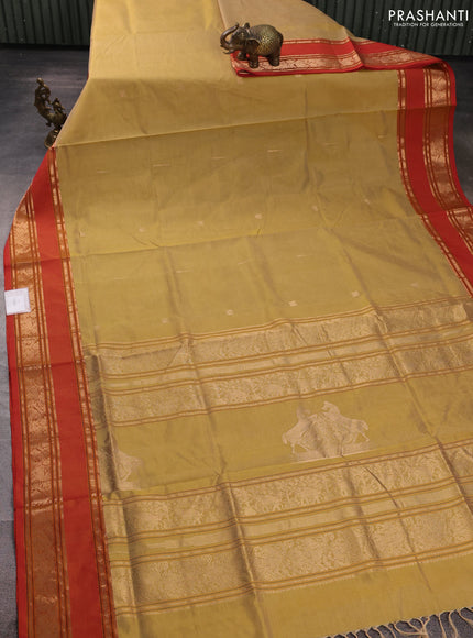 Kanchipuram silk cotton saree sandal and orange with zari woven buttas and rettapet zari woven border