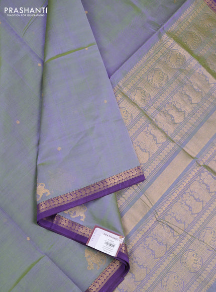 Kanchipuram silk cotton saree dual shade of green and purple with zari woven buttas and small zari woven border