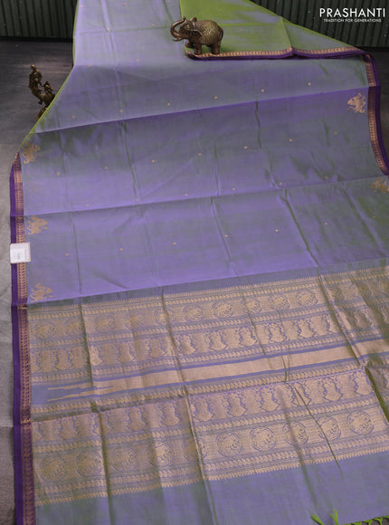 Kanchipuram silk cotton saree dual shade of green and purple with zari woven buttas and small zari woven border