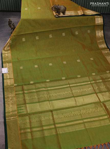 Kanchipuram silk cotton saree dual shade of greenish orange and green with zari woven buttas and zari woven border