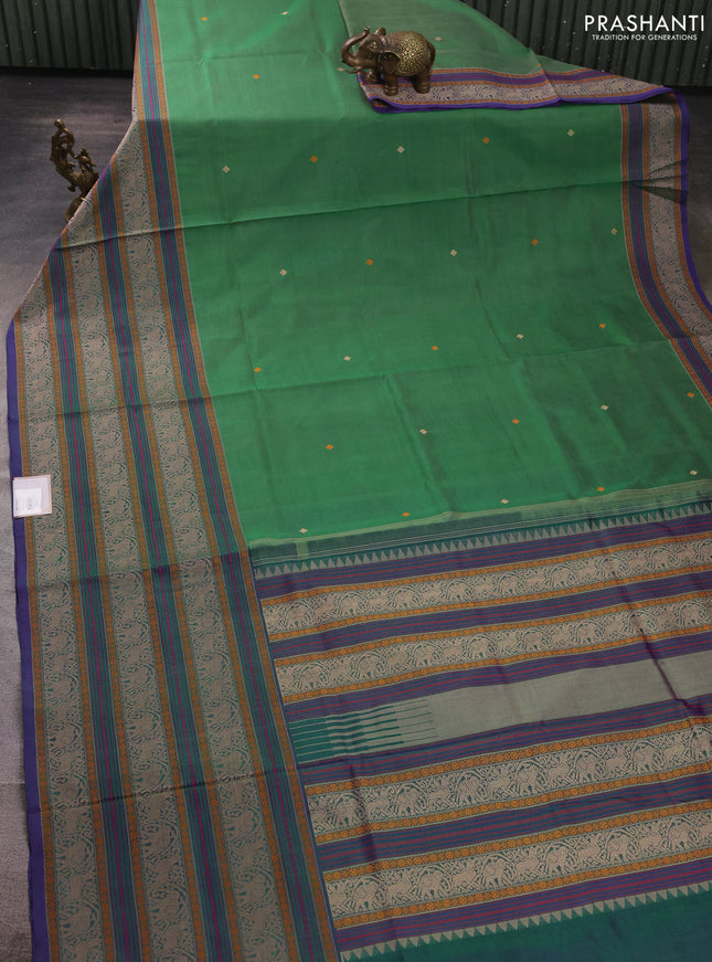 Kanchipuram silk cotton saree green and purple with thread woven buttas and long thread woven border