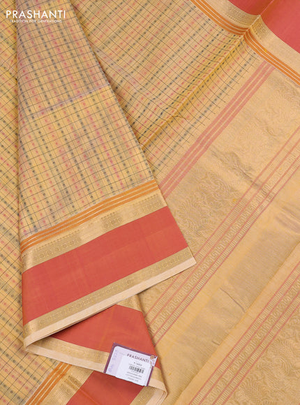 Kanchipuram silk cotton saree pale yellow and dual shade of orange with allover thread checks & 1000 buttas and rettapet zari woven border