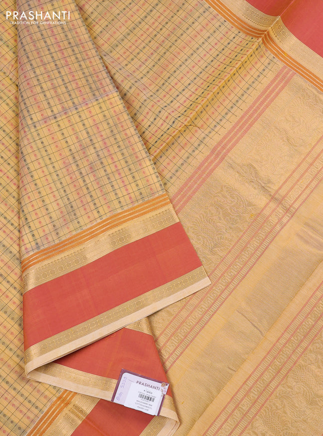 Kanchipuram silk cotton saree pale yellow and dual shade of orange with allover thread checks & 1000 buttas and rettapet zari woven border